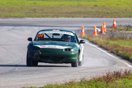 Kakucs Hungary - October 15th 2022: European Rallycross championship modified rally car driving on slalom course at the international rally event.のeditorial素材