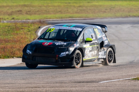 Kakucs Hungary - October 15th 2022: European Rallycross championship modified rally car driving on slalom course at the international rally event.のeditorial素材