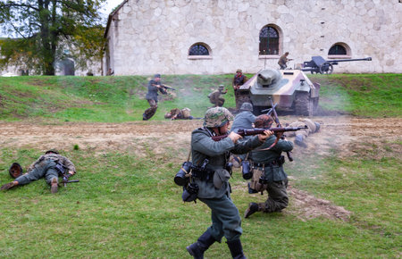 Komarom Hungary fort of Monostor Oct. 2 22: Reenactors World War II German Wehrmacht, SS Soldiers Fighting with invading Soviet red army forces. Free public event.のeditorial素材