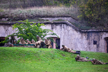 Komarom Hungary fort of Monostor Oct. 2 22: Reenactors World War II German Wehrmacht, SS Soldiers Fighting with invading Soviet red army forces. Free public event.のeditorial素材