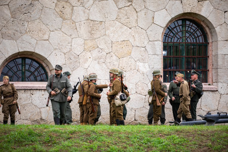 Komarom Hungary fort of Monostor Oct. 2 22: Reenactors World War II German Wehrmacht, SS Soldiers Fighting with invading Soviet red army forces. Free public event.のeditorial素材