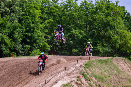 Tapiobicske Hungary - June 11, 23 :  Unidentified racers in MX2  MX2 race during the open, Motocross Championship.のeditorial素材