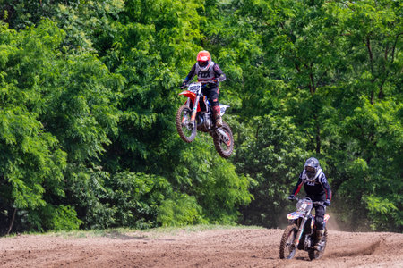 Tapiobicske Hungary - June 11, 23 :  Unidentified racers in MX2  MX2 race during the open, Motocross Championship.のeditorial素材