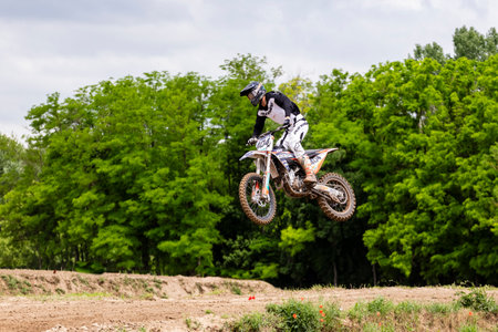 Tapiobicske Hungary - June 11, 23 :  Unidentified racers in MX2  MX2 race during the open, Motocross Championship.のeditorial素材
