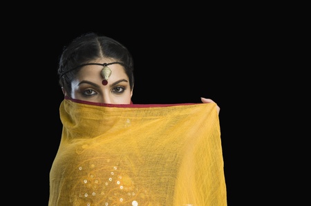 Close-up of a woman covering her face with chunniの写真素材