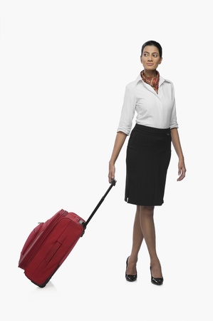 Air hostess carrying her luggageの写真素材