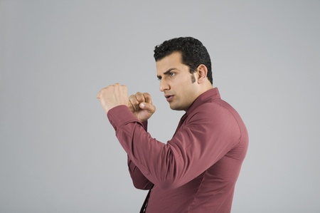 Businessman in boxing poseの写真素材