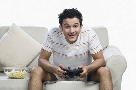 Man playing a video game and looking excited