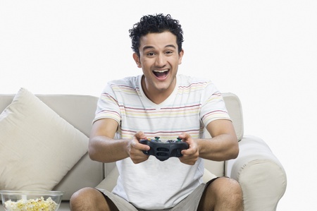 Man playing a video game and looking excited