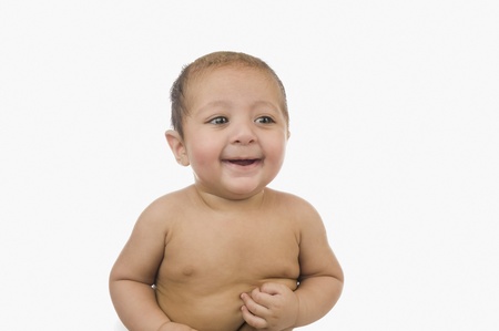 Close-up of a baby boy smilingの写真素材