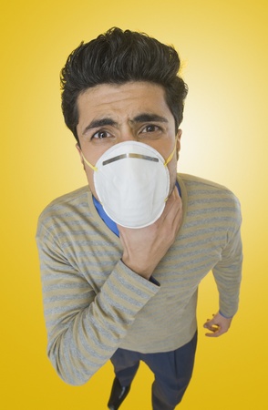 Businessman wearing pollution maskの写真素材
