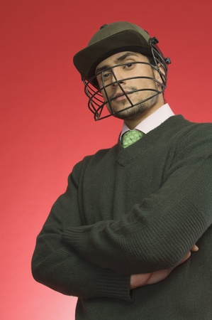 Businessman wearing a cricket helmetの写真素材