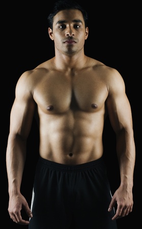 Portrait of a muscular man showing his absの写真素材