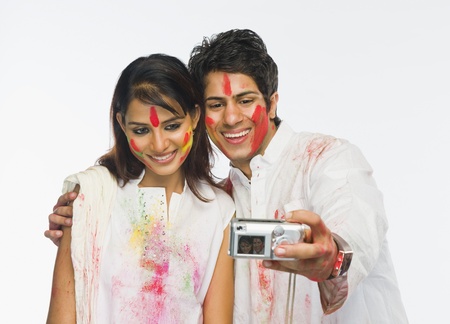 Couple taking a picture of themselves on Holiの写真素材