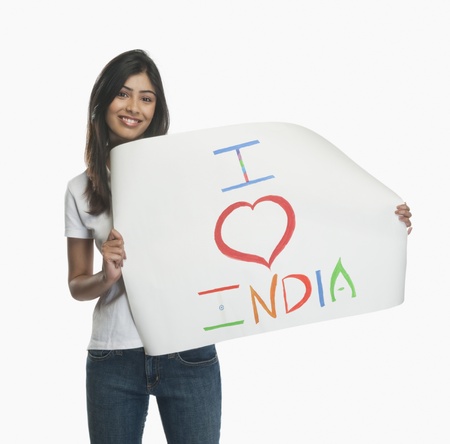 Woman holding a placard with text I Love India written on itの写真素材