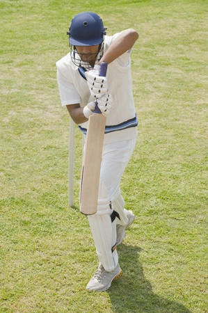 Batsman in backward defense stance