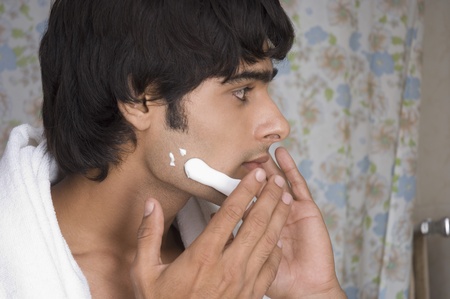 Man applying shaving cream on his faceの写真素材