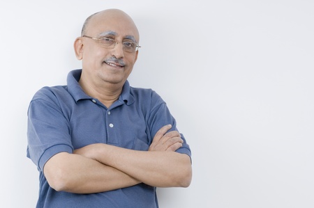 Portrait of a man with his arms crossed and smilingの写真素材