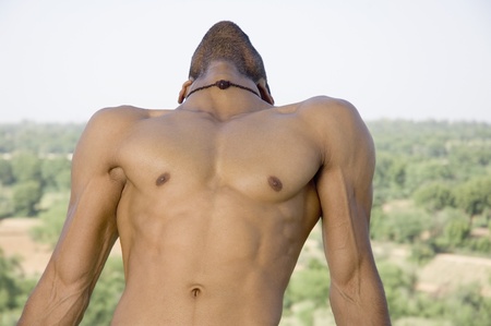 Close-up of a macho man stretching
