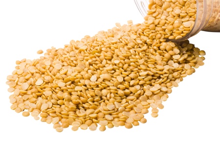 Close-up of pigeon pulses spilling from a jarの写真素材