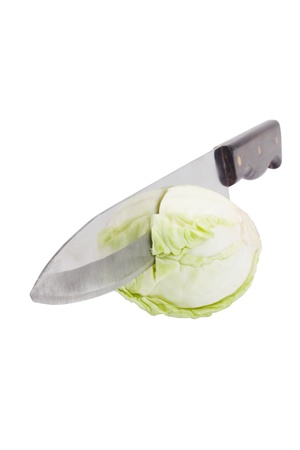 Close-up of a knife cutting a cabbageの写真素材