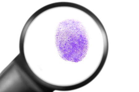 Fingerprint viewed through a magnifying glassの写真素材