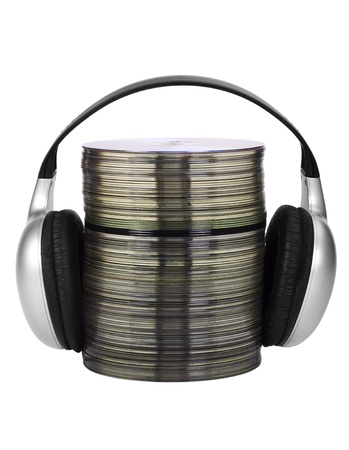 Stack of compact discs with headphonesの写真素材