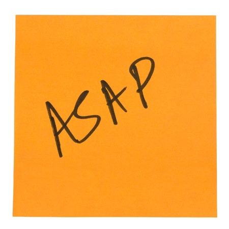 Word ASAP written on an adhesive noteの写真素材