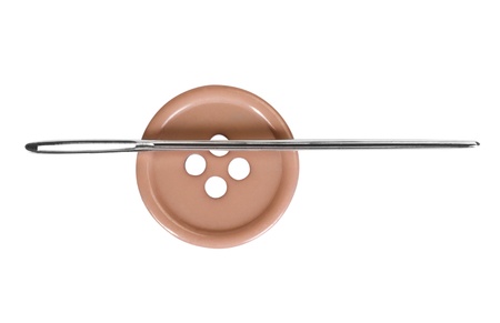 Close-up of a needle in the button holeの写真素材