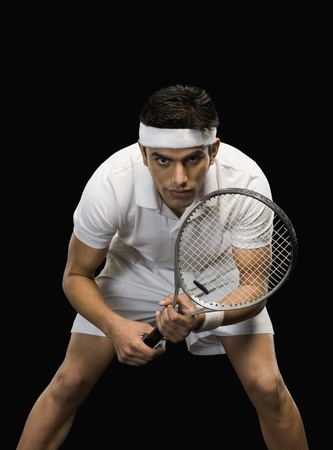 Tennis player practicing with a tennis racketの写真素材