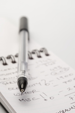 Close-up of a pen on a spiral notebookの写真素材