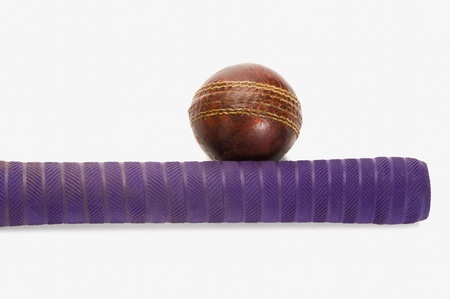 Close-up of a cricket ball with a batの写真素材