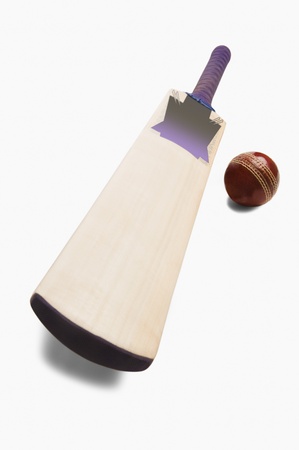 Close-up of a cricket ball with a batの写真素材