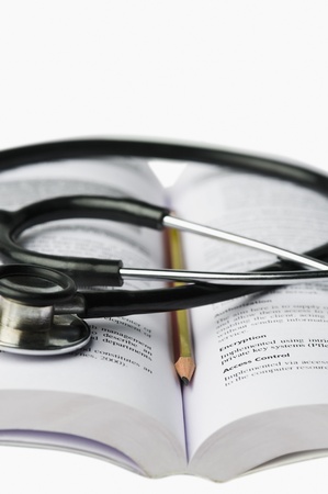 Close-up of a stethoscope on an open bookの写真素材