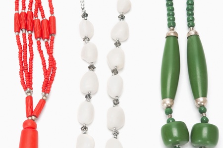Close-up of tricolor necklaces representing Indian flag colorsの写真素材