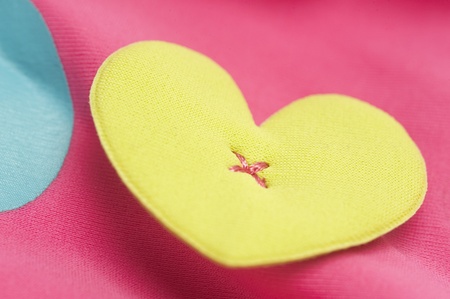Close-up of a heart shape on a baby's topの写真素材