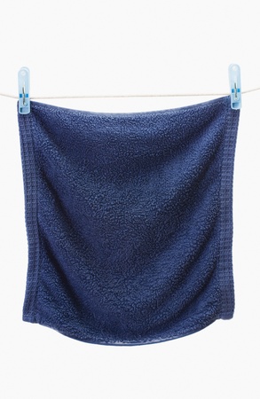 Close-up of a towel drying on a clotheslineの写真素材