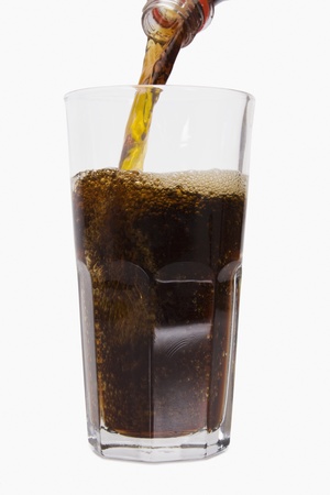 Close-up of cold drink being poured into a glassの写真素材