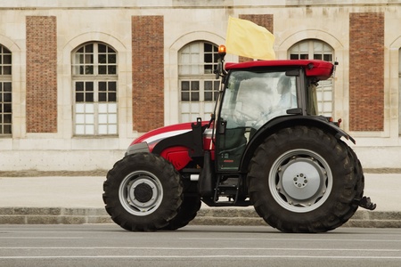 Tractor in front of a building, Paris, France