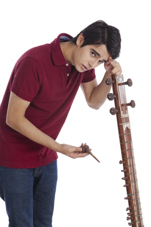 Man leaning over his broken sitarの写真素材