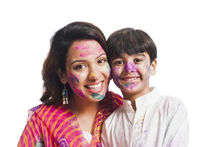 Portrait of a woman with her son celebrating Holi festivalの写真素材