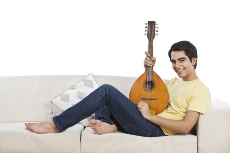 Portrait of a man playing a mandolin