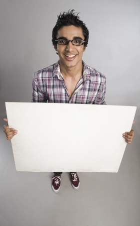 Man standing with a placardの写真素材