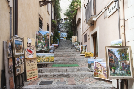 Display of paintings along the alley, Taormina, Province of Messina, Sicily, Italyのeditorial素材
