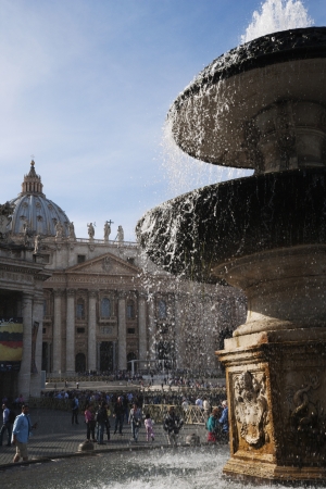 Fountain with a basilica in the background, St. Peters Basilica, St. Peters Square, Vatican Cityのeditorial素材
