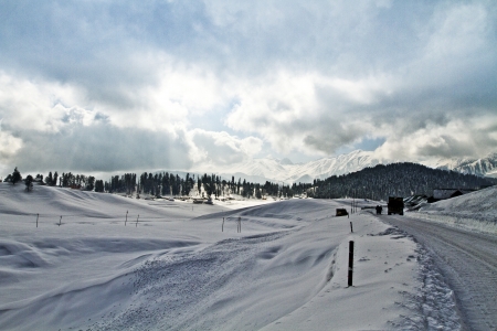 Clouds over a snow covered landscape, Kashmir, Jammu And Kashmir, Indiaの写真素材