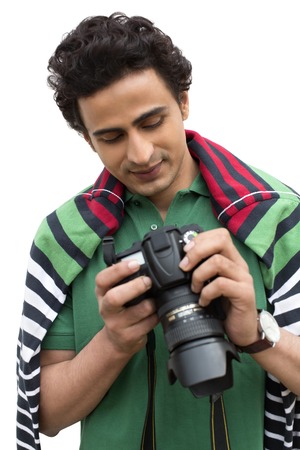 Male photographer holding a camera