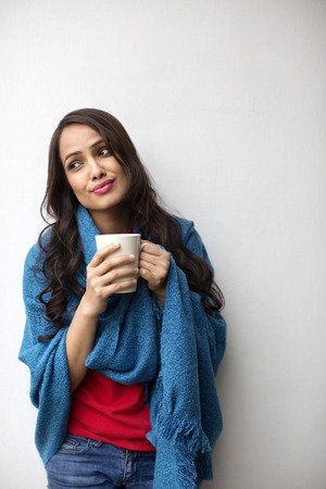 Close-up of a woman holding a coffee mugの写真素材