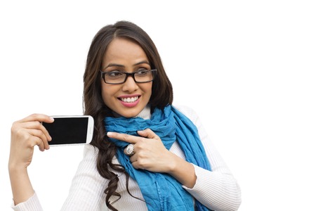 Smiling woman pointing at a mobile phone