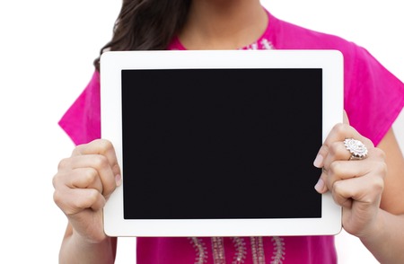 Mid section view of a woman showing a digital tablet